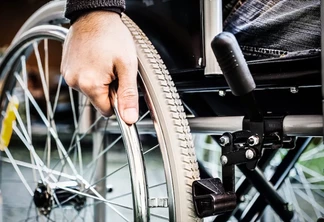 Paralyzed man using his wheelchair